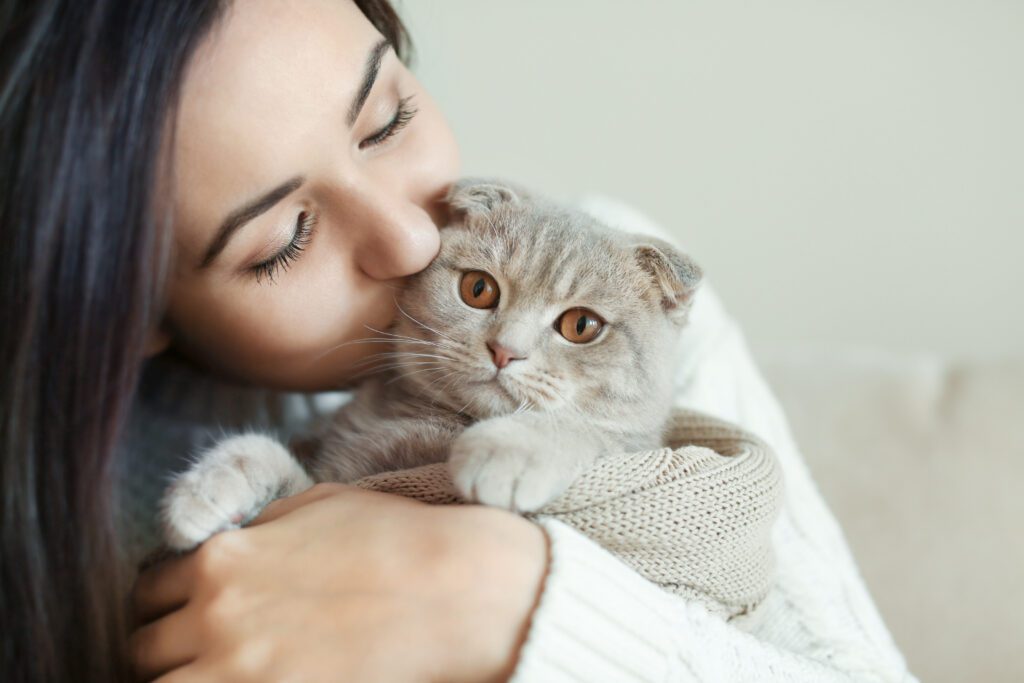 happy cat with owner